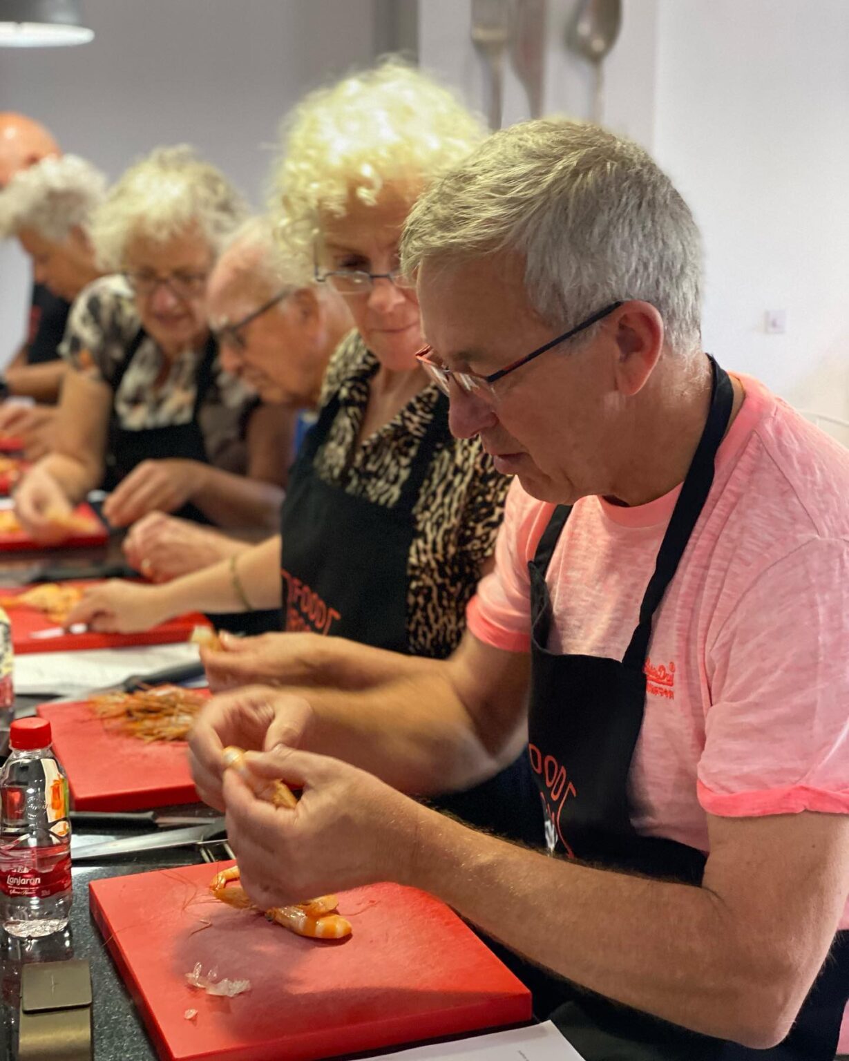 spanish-cooking-couple-peeling-shrimps