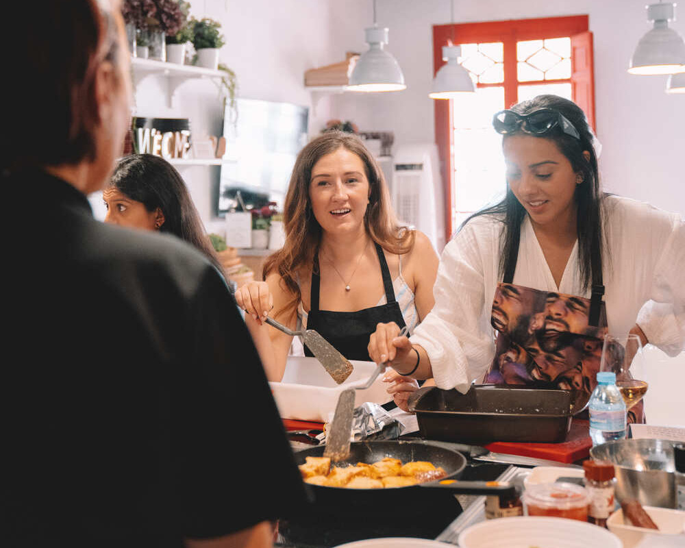 spanish-cooking-course-girls-listening-to-mariola
