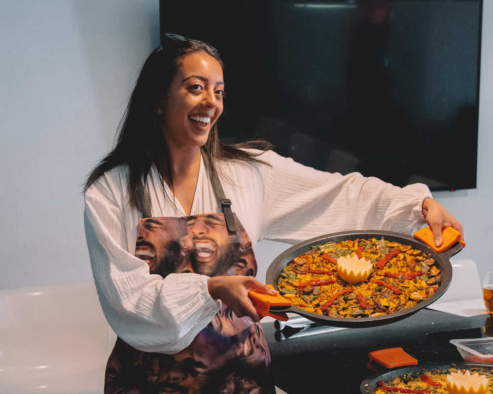 spanish-cooking-course-happy-girl-with-paella-dish